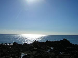 a view of the ocean from a rocky beach at Appartement rénové 1 chambre ,rez de jardin,belle terrasse,proche plages,Carnac 2025-00427 in Carnac