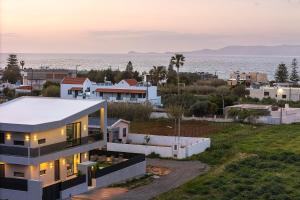 a house with a view of the ocean at Resmi SeaView Villa,By IdealStay Experience in Kokkíni Khánion