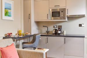 Eldhús eða eldhúskrókur á Waterloo Town House & Suites