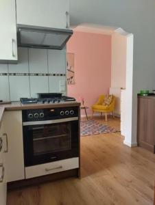 a kitchen with a stove top oven in a room at Sweet home No 3 Ferienwohnung Apartment in Kevelaer