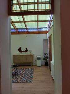 a living room with a skylight and a desk in a room at Sweet home No 3 Ferienwohnung Apartment in Kevelaer