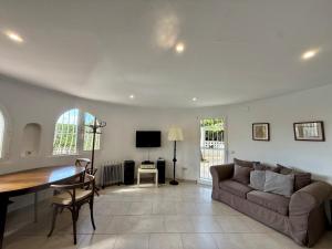 a living room with a couch and a table at AT060 Villa Ortenbach in Ifach