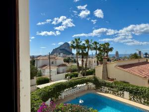 a view from the balcony of a building with a swimming pool at AT060 Villa Ortenbach in Ifach