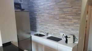 A kitchen or kitchenette at Welcoming studio in Torremolinos 45 m² with shared pool