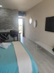 A television and/or entertainment centre at Welcoming studio in Torremolinos 45 m² with shared pool