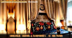 a room with curtains and a bench with a pillow at Central Apartments in Poznań