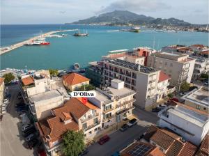 an aerial view of a city with a harbor at D'Oliva, by ZanteWize in Zakynthos Town