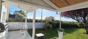 a screened in porch with a view of a yard at Les Granges in Vigoulant +39 photos
