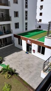 an aerial view of a building with a tennis court at Romi Homes in Mombasa +18 photos