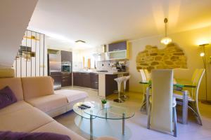 a living room with a couch and a table at House Nonina kuca in Rab