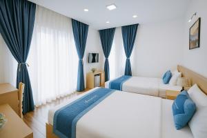 Voodi või voodid majutusasutuse Tuan Thuy Hotel toas