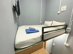 a small room with a bunk bed in it at Helloroom Mampang Jl Bank in Jakarta +5 photos