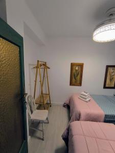Posteľ alebo postele v izbe v ubytovaní Casa Abuela