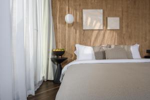 Postel nebo postele na pokoji v ubytování Dali Shuanglang Gesang Seaview Hotel