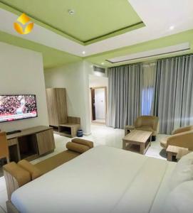 TV a/nebo společenská místnost v ubytování OTI Hotel Benin