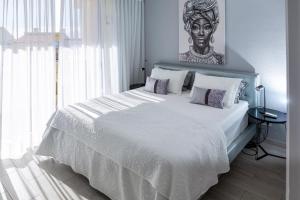 Postel nebo postele na pokoji v ubytování Dachterrassen Wohnung Teneriffa