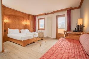 Postel nebo postele na pokoji v ubytování Gaarten Hotel Benessere Spa by Kleos Group Collection