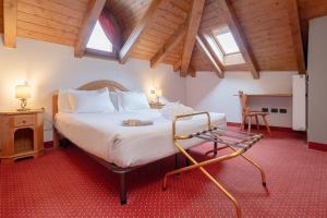 Postel nebo postele na pokoji v ubytování Gaarten Hotel Benessere Spa by Kleos Group Collection