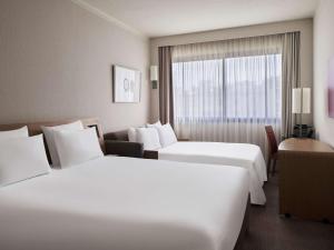 Postel nebo postele na pokoji v ubytování Novotel Athens