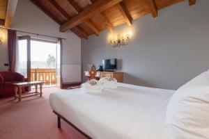 Postel nebo postele na pokoji v ubytování Gaarten Hotel Benessere Spa by Kleos Group Collection