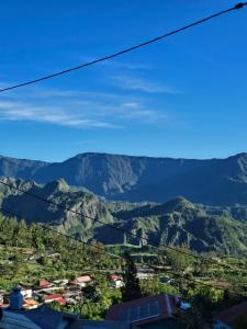a view of the mountains from a zip line at L'Eveil des Sommets in Salazie
