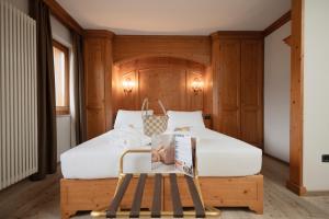 Postel nebo postele na pokoji v ubytování Gaarten Hotel Benessere Spa by Kleos Group Collection