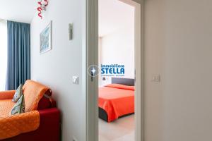 Postel nebo postele na pokoji v ubytování Condominio Mimose