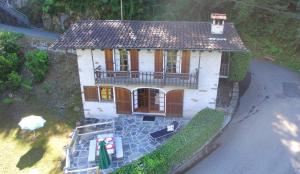 an overhead view of a small house with a balcony at Casa Mathey by HolAp SA in Magadino