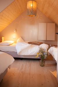 Postel nebo postele na pokoji v ubytování Ecohome Zilt - 8 pers - Zeezand Recreatie