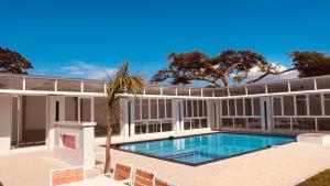 an exterior view of a house with a swimming pool at Lamamie Suite Lodge in Thohoyandou
