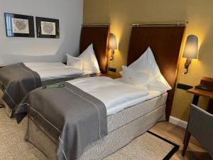 Postel nebo postele na pokoji v ubytování Boutique-Hotel Moseltor