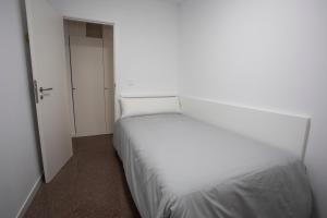 Postel nebo postele na pokoji v ubytování Residencia Universitaria Resa Colegio de Cuenca