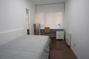 Postel nebo postele na pokoji v ubytování Residencia Universitaria Resa Colegio de Cuenca