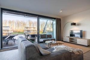 Μια τηλεόραση ή/και κέντρο ψυχαγωγίας στο Hello Zeeland - Veerse Wende - Zeekraal 8