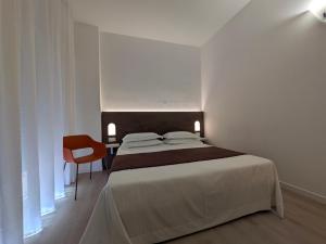 Postel nebo postele na pokoji v ubytování Hotel Piccolo