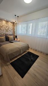 Ένα ή περισσότερα κρεβάτια σε δωμάτιο στο Exclusive Home Szeged +45 φωτογραφίες