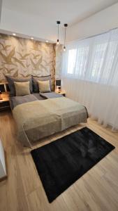Ένα ή περισσότερα κρεβάτια σε δωμάτιο στο Exclusive Home Szeged