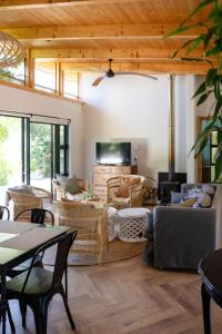 a living room with couches and a tv at Camissa Farm in Stellenbosch