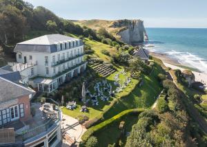 an aerial view of a hotel and the ocean at Dormy House in Étretat