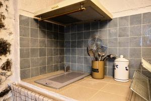 a kitchen counter with a kitchen utensils in a corner at CASA MIA - Maison et chambres à louer à Corbara in Corbara +110 photos