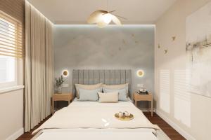 a bedroom with a large bed and a ceiling fan at Mużakowski Forest Retreat - rezydencja z basenem in Bronowice +26 photos