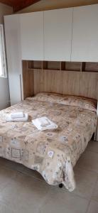 Postel nebo postele na pokoji v ubytování Isola Rossa Appartamenti Paduledda