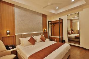 Ένα ή περισσότερα κρεβάτια σε δωμάτιο στο Hotel Skyvista