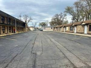 an empty parking lot in a small town at Des Plaines Motel By OYO O'Hare Airport Chicago in Des Plaines