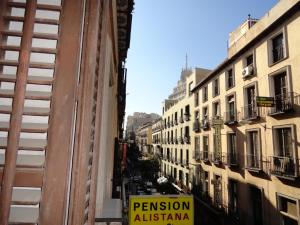 a view of a city street with buildings at Hostal Alistana in Madrid