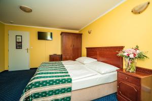 Postel nebo postele na pokoji v ubytování Hotel Otakar