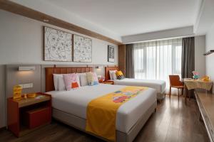 Postel nebo postele na pokoji v ubytování OneJasper Horizon Hotel