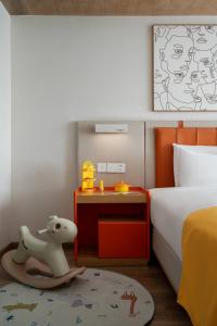 Postel nebo postele na pokoji v ubytování OneJasper Horizon Hotel