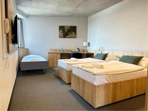 Postel nebo postele na pokoji v ubytování Hotel D1
