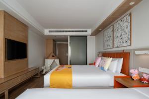 Postel nebo postele na pokoji v ubytování OneJasper Horizon Hotel
